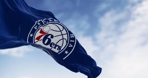 Flag of Brooklyn Nets waving in the wind on a clear day Stock Illustration