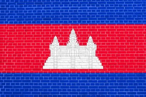 Flag of Cambodia on brick wall texture background Illustrazione stock