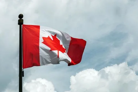 Flag of Canada on flagpole floating in the sky Stock-Fotos