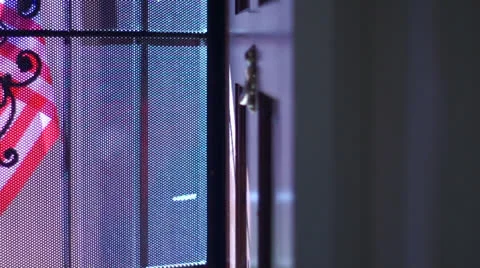 Flag casting shadow on screen door (7 sec) Stockbeeldmateriaal 26108053