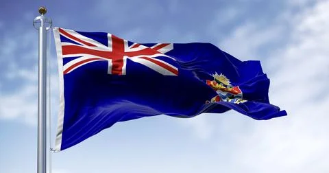 Flag of Cayman Islands waving in the wind on a clear day Stock Illustration