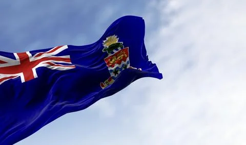 Flag of Cayman Islands waving in the wind on a clear day Stock Illustration