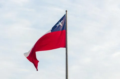 The flag of Chile on top of the pole, also known as The Lone Star. Stock Photos