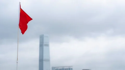The flag of China is set on a flagpole against the background of which a cloudy Stock-Footage 115596772