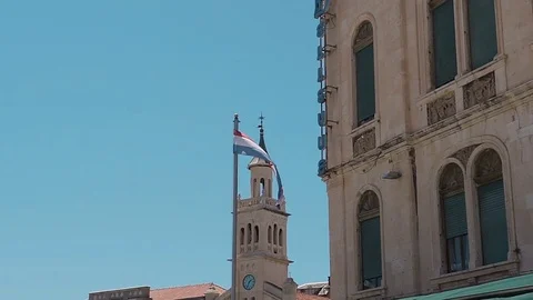 Flag of the city of Split, Croatia. Against the background of a cloudless sky Stock Footage 80645489