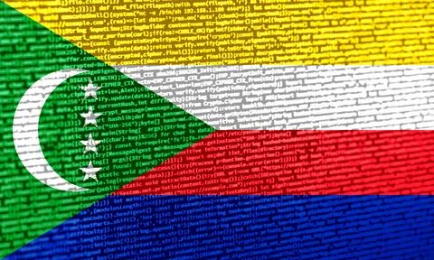 Flag of the Comoros over digital code. Concept of cybersecurity, innovation.. Stock Photos