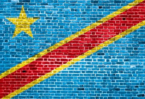 Flag of Congo painted on brick wall, background texture Stock Photos