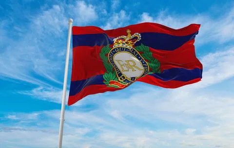 Flag of the Corps of Royal Engineers Camp at cloudy sky background on sunset. Stock Illustration