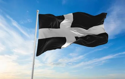 Flag of county Cornwall, UK at cloudy sky background on sunset, panoramic vie Stock Illustration
