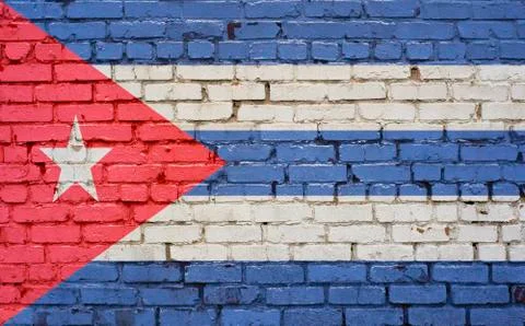 Flag of Cuba painted on brick wall, background texture Stock Photos