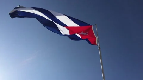 The flag of Cuba waving in the wind against a blue sky Video stock 52485168