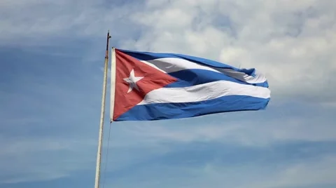 The flag of Cuba waving in the wind against a blue sky 스톡 동영상 52548330