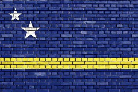 Flag of Curacao painted on brick wall Stock Illustration