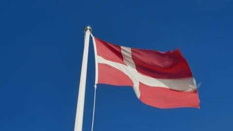 Flag of Denmark against blue sky Stock Footage 202631133