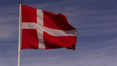 The flag of Denmark, the Dannebrog, flutters in breeze in slightly slower motion Stock Footage