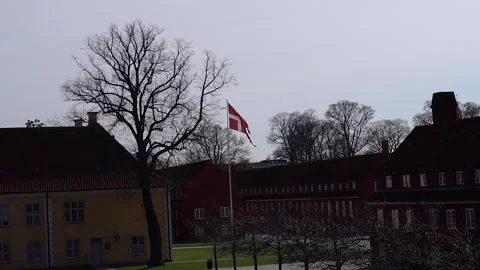 Flag of Denmark. Raised flag of Denmark in the city. Stock Footage 269581450