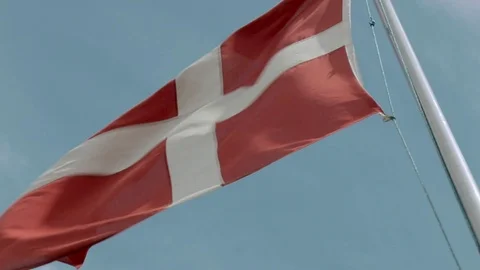 Flag of Denmark waving in the wind against blue sky. Danish flag. Stock Footage 104852972