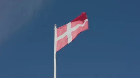 Flag of Denmark waving in the wind against blue sky Stock Footage 158883868