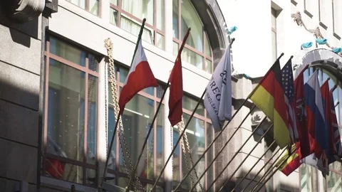 Flag of different countries. Many international flags on front of the hotel Stock Footage 83186094