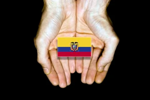 Flag of Ecuador in hands on black background Stock Photos