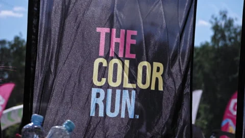The flag of the festival The Color Run develops at the finish 스톡 동영상 204860368