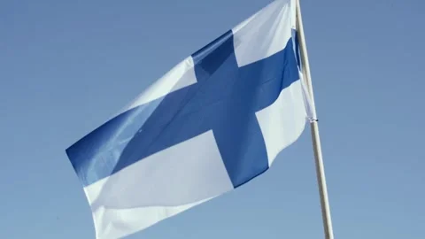 Flag of Finland, develops against the blue sky. Stock Footage 250114371