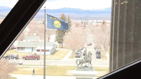 Flag Fluttering Through Montana State Capitol Building Window Video stock 107066806
