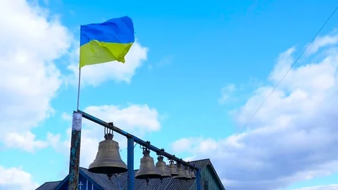 The flag flying in the wind close to the bells Stock Footage 71253301