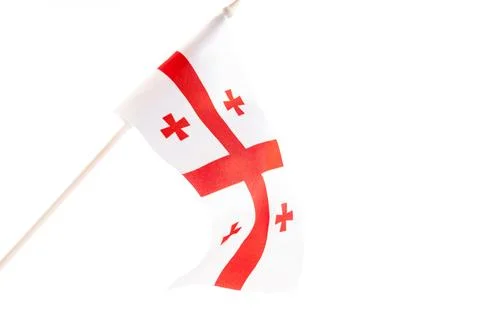 The flag of Georgia on a black background develops and flies waving in the wind Stock Photos