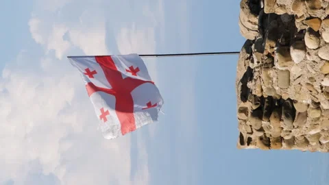 Flag of Georgia on an old tower Vídeos de archivo 255605598