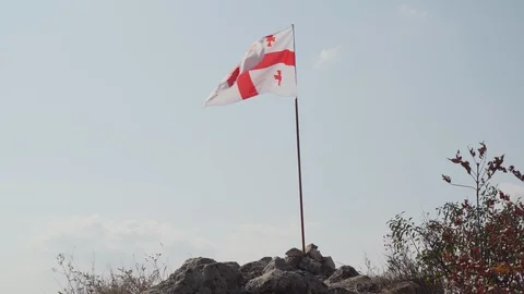 Flag of Georgia placed on old medieval castle Stock Footage 123998891