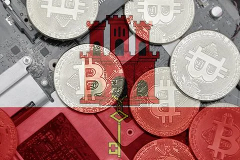 Flag of gibraltar on the bitcoins with computer electronic circuit board ba.. Stock Photos