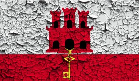 Flag of Gibraltar with old texture. Vector Stock Illustration