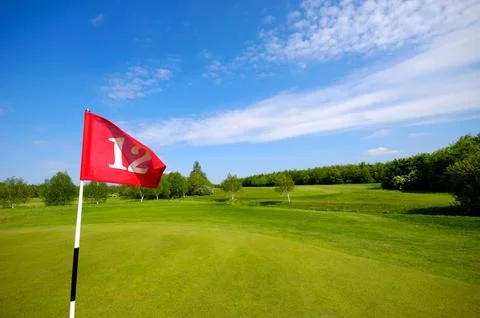 Flag on golf course Stock Photos