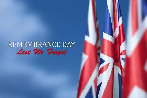 Flag of Great Britain with Text on background of blue sky. Holidays of the UK. Stock Photos