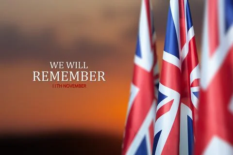 Flag of Great Britain with Text on background of sunset. Holidays of the UK. Stock Photos