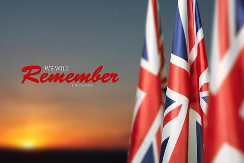 Flag of Great Britain with Text on background of sunset. Holidays of the UK. Stock Photos
