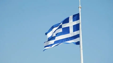 Flag of Greece on a blue sky background Vídeos de archivo 220137140