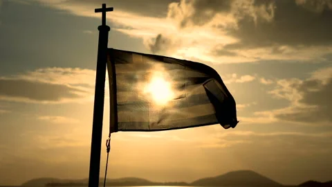 Flag of Greece flying in wind on a ship sailing on sea at dusk. Slow motion. HD Stock-Footage 111829076