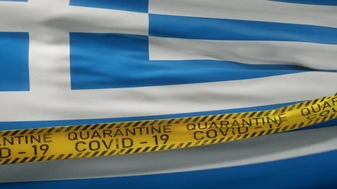 Flag of Greece waving on wind with Covid-19 quarantine tape Stock Footage 127880154