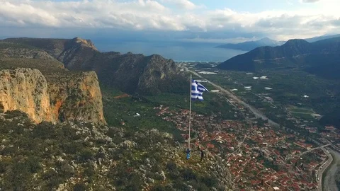 Flag of Greece in the wind at the top of the mountain Stock Footage 86113610