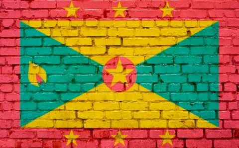 Flag of Grenada painted on brick wall, background texture Stock Photos