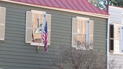 Flag hanging in front of confederate home in charleston Stock Footage 45533730