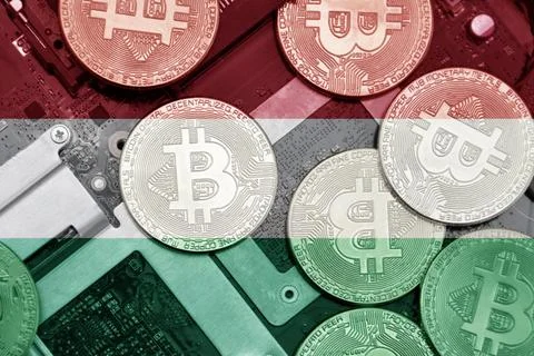 Flag of hungary on the bitcoins with computer electronic circuit board back.. Stock Photos