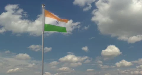 The Flag of India flies majestically over a blue sky and moving clouds Stock Footage 240956184