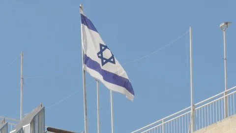 Flag of Israel flying in the wind Stock Footage 124037823