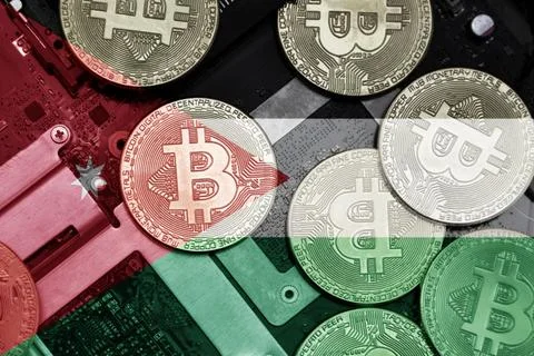 Flag of jordan on the bitcoins with computer electronic circuit board backgro Stock-Fotos