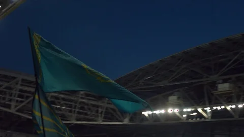The flag of Kazakhstan and Astana is developing over the stands before the match Stock Footage 118732132