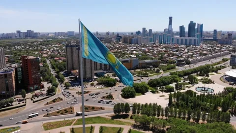 The flag of Kazakhstan is developing in the wind.Astana - Nur Sultan. Stock Footage 131232040