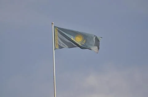 The flag of Kazakhstan develops in the wind Stock Photos